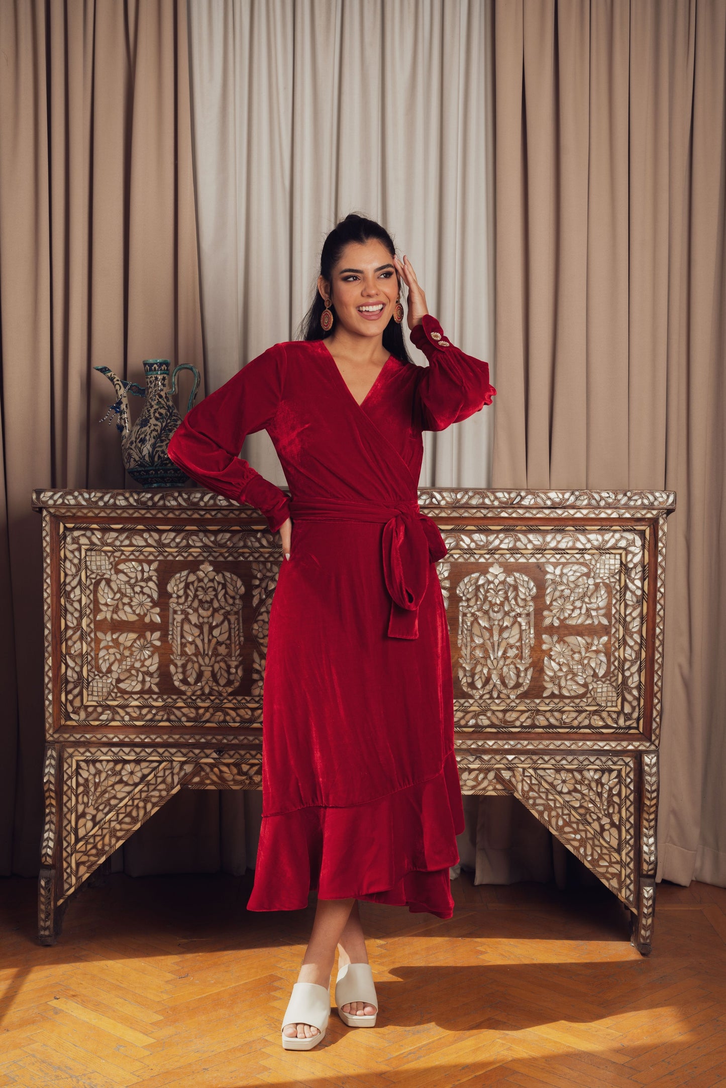 A stunning red velvet wrap dress