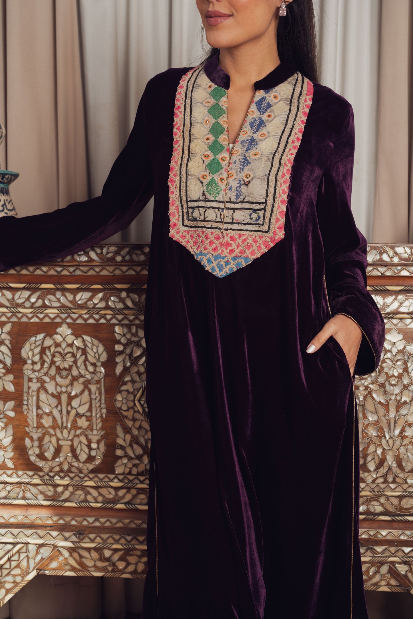 A luxurious deep purple velvet kaftan