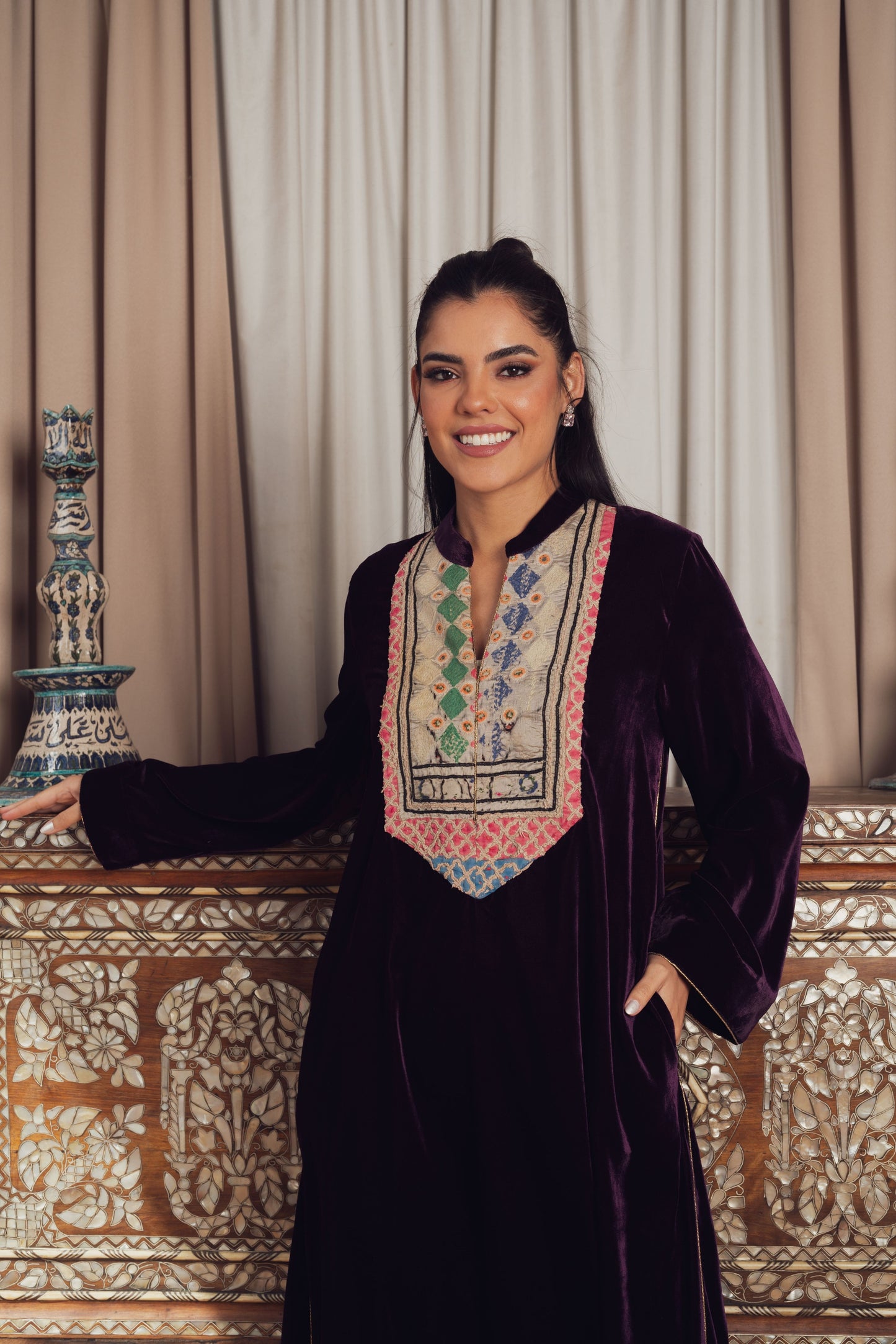 A luxurious deep purple velvet kaftan