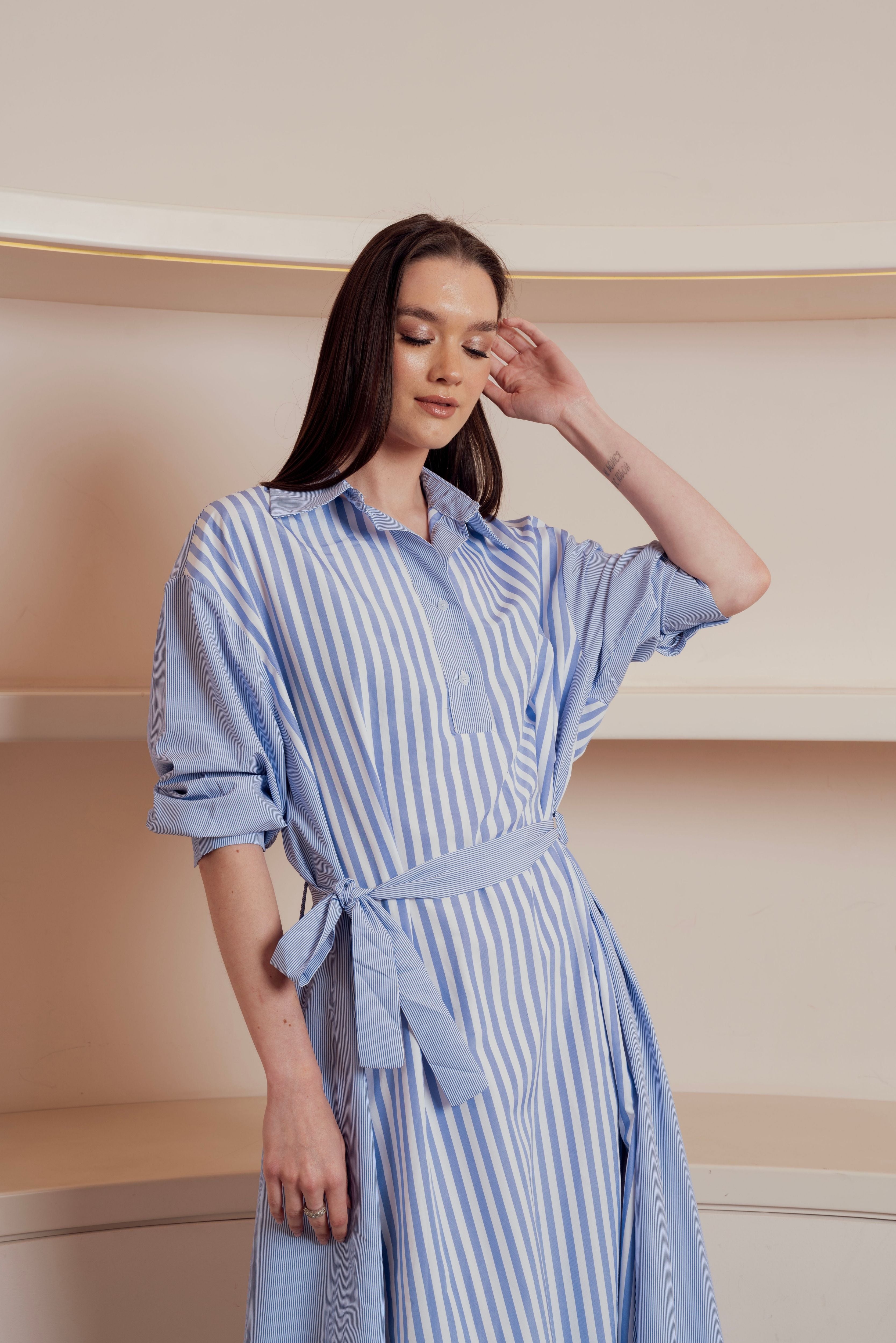 Blue and white striped shirt dress with waist tie and rolled-up sleeve