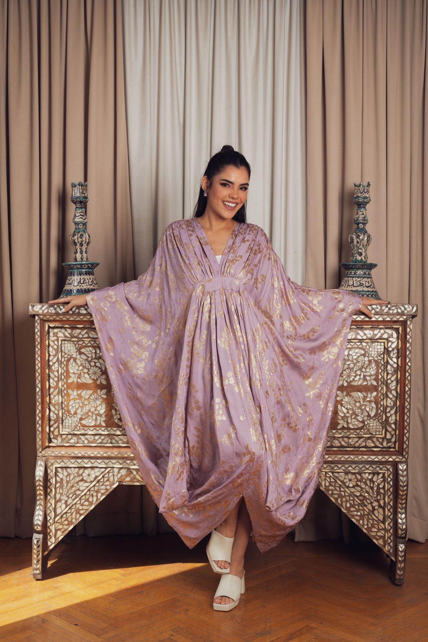 A dreamy lilac kaftan adorned with delicate gold