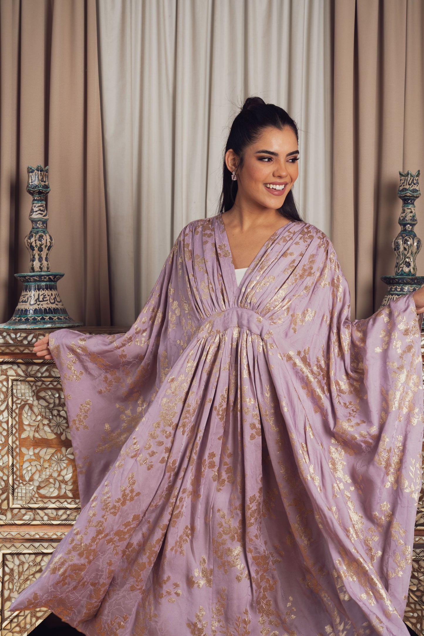 A dreamy lilac kaftan adorned with delicate gold