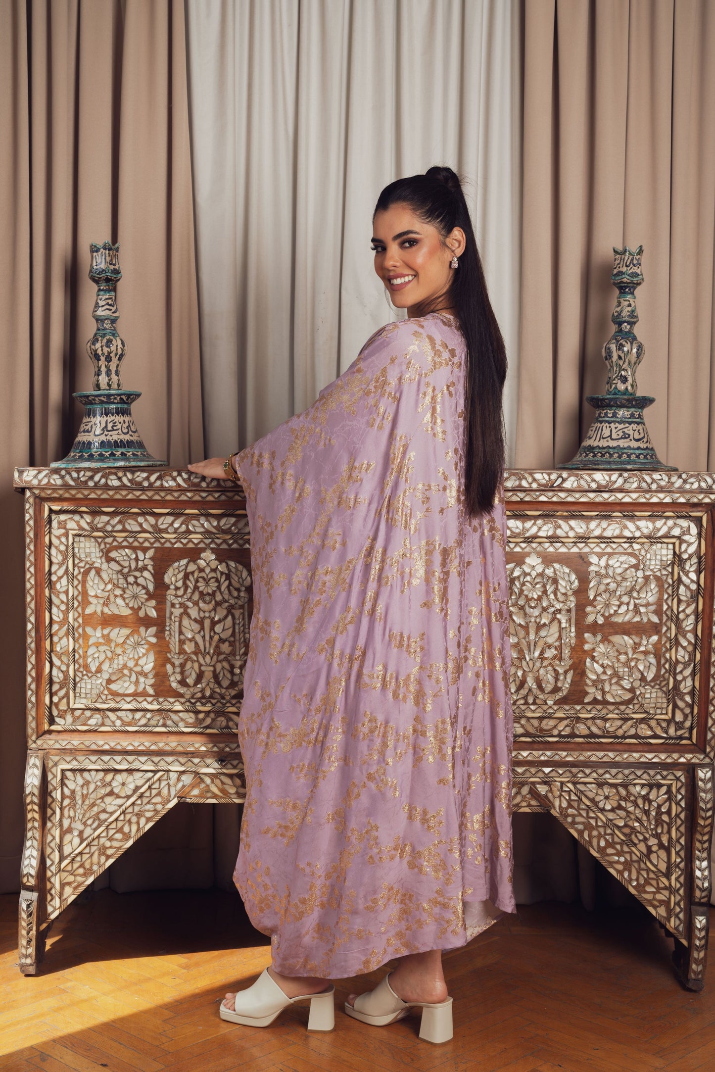 A dreamy lilac kaftan adorned with delicate gold