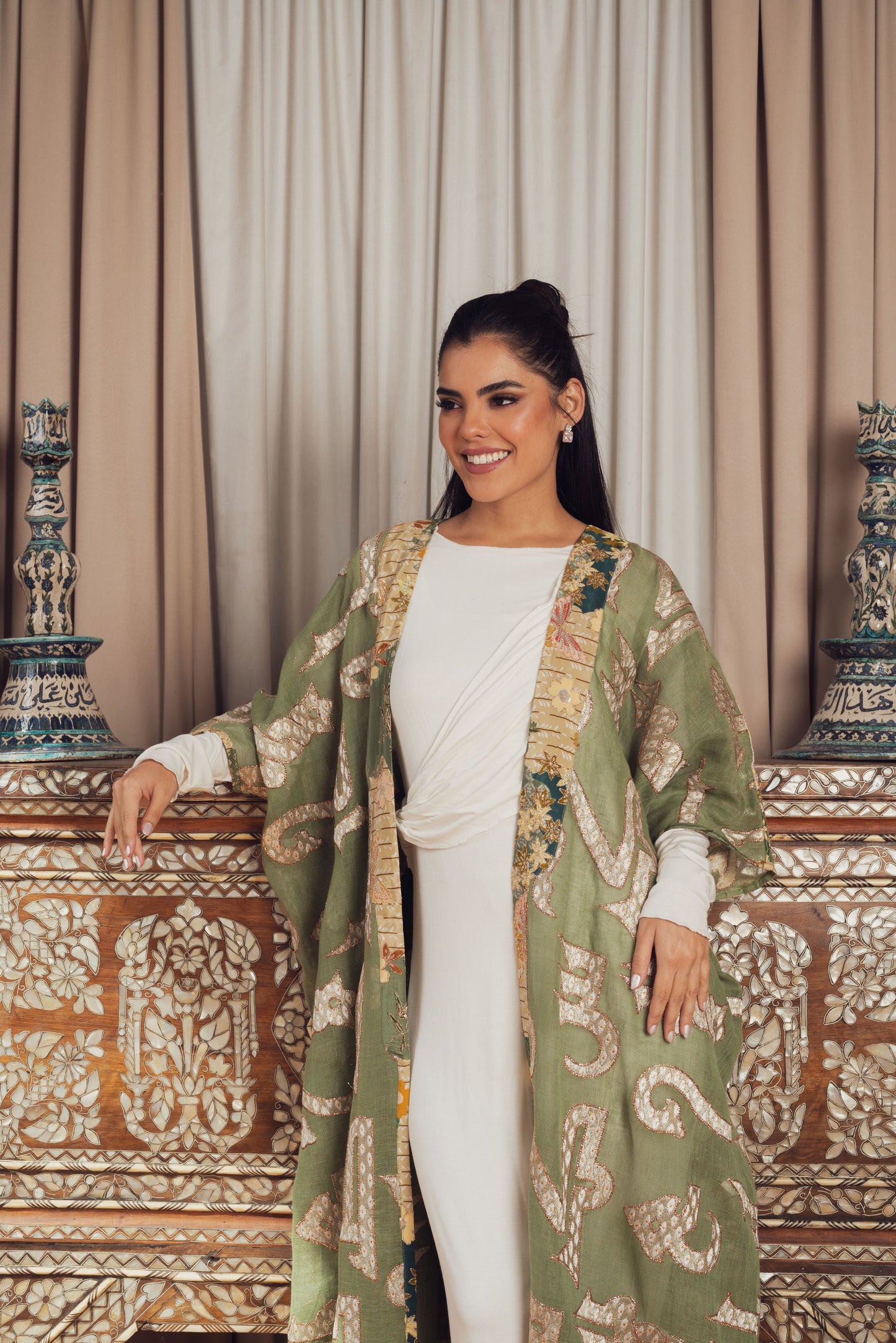 A chic olive green open-front kaftan