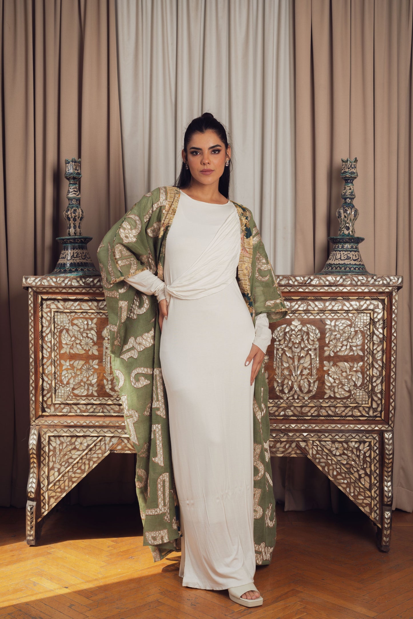 A chic olive green open-front kaftan