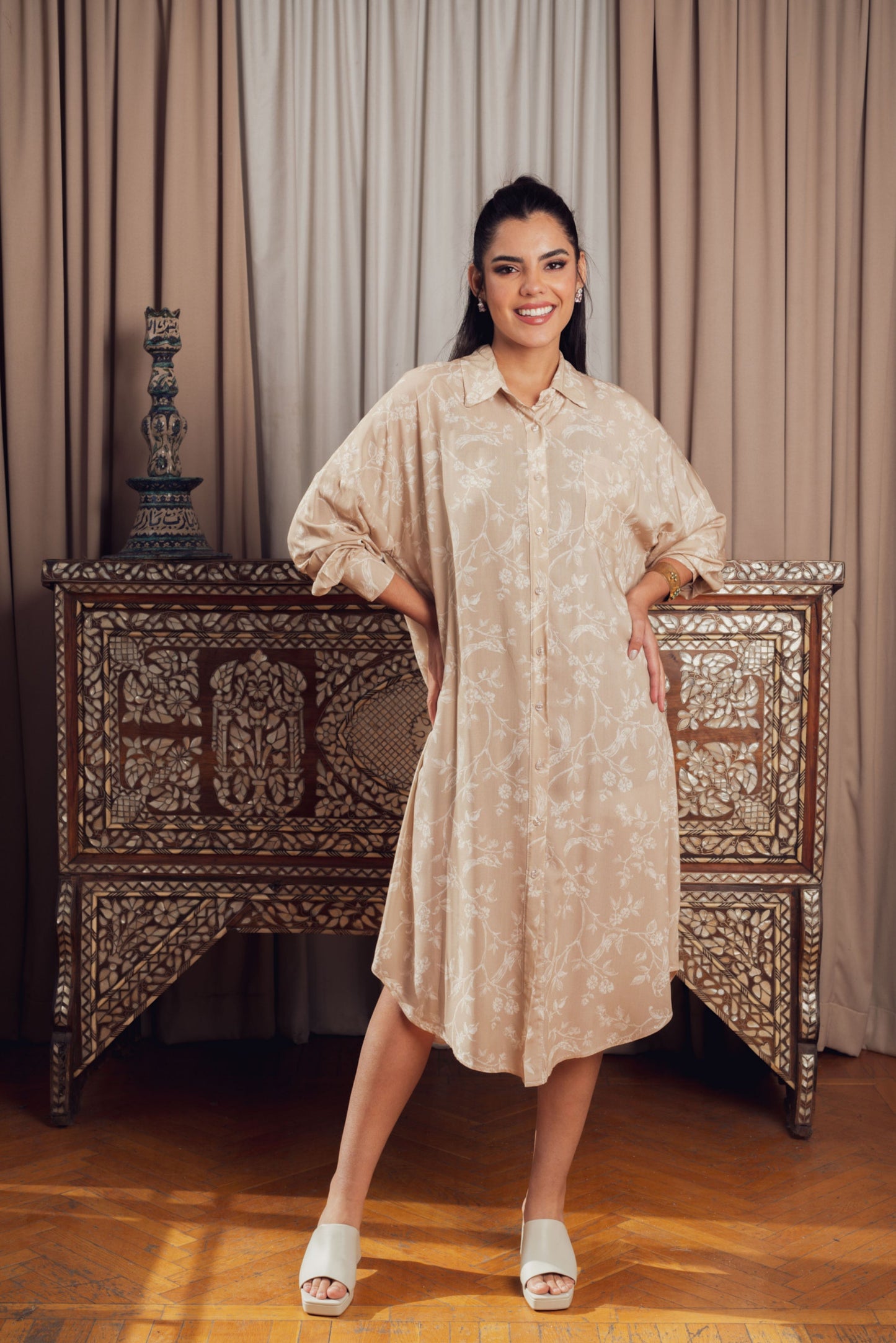 A relaxed yet stylish light beige shirt dress