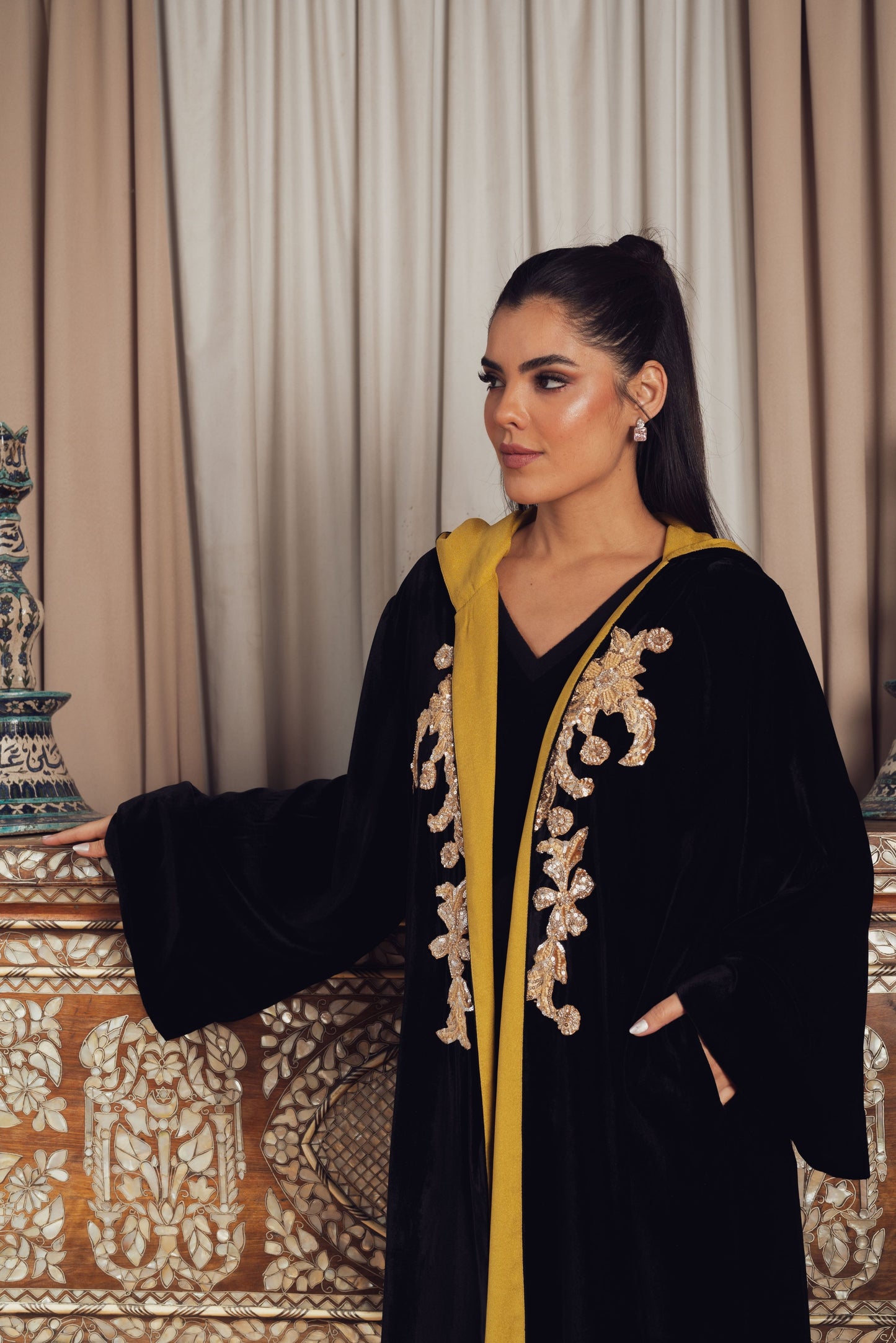 An elegant black velvet abaya