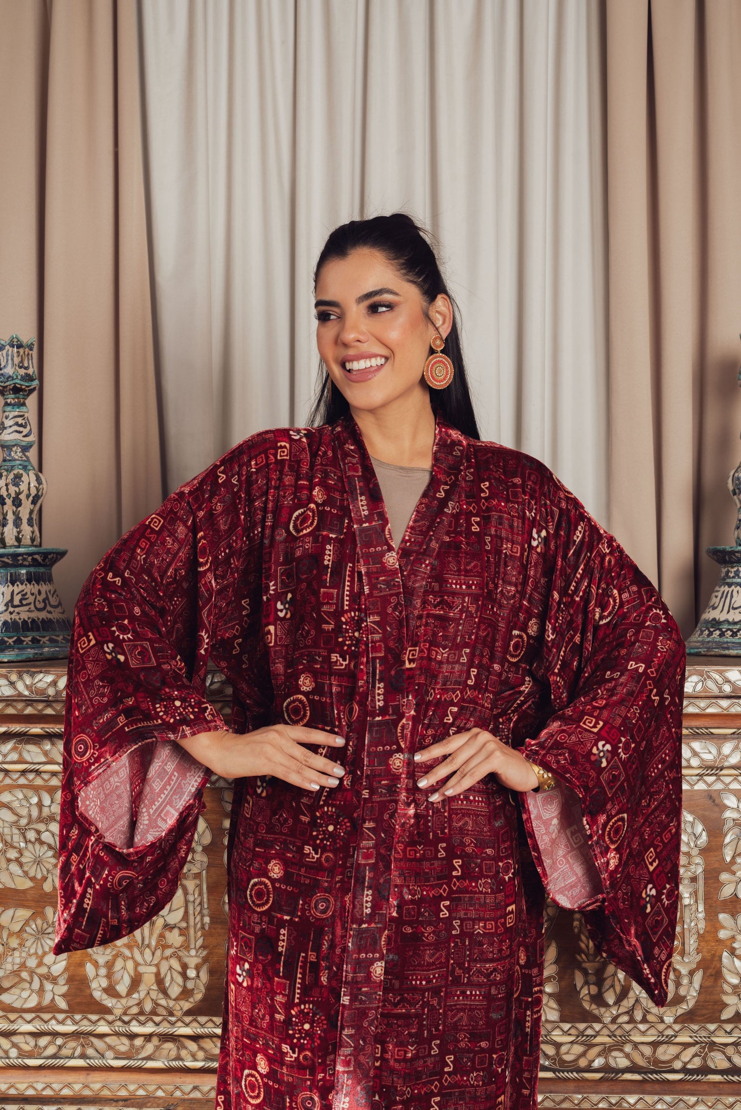 A luxurious deep red velvet kaftan