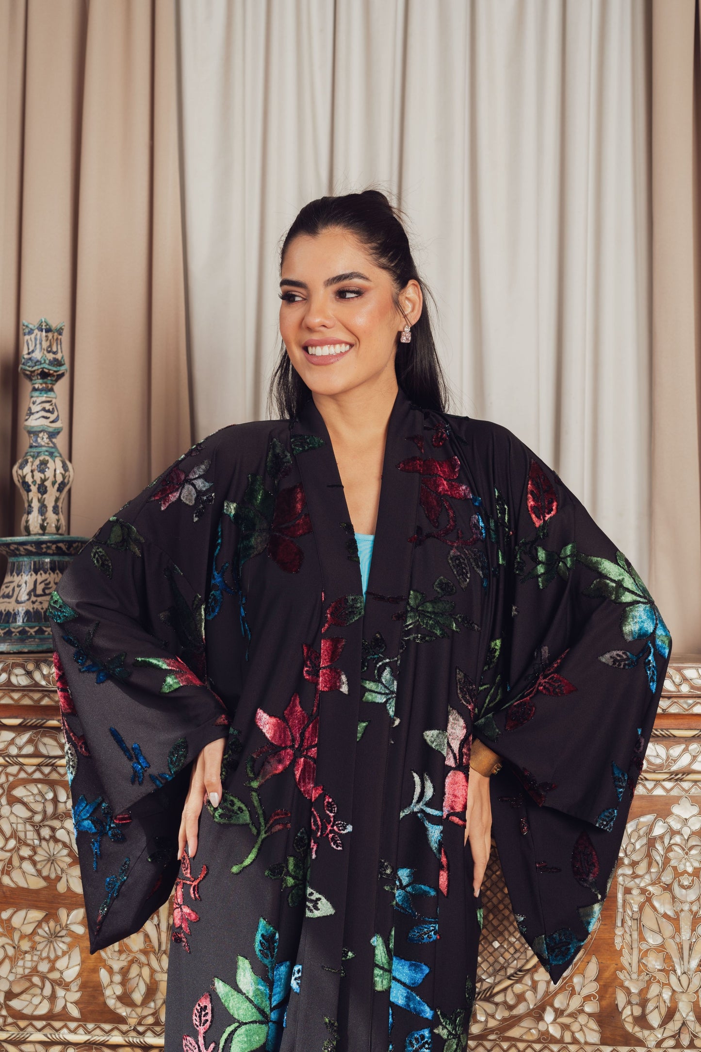 Dramatic florals meet luxurious velvet in this statement kimono.