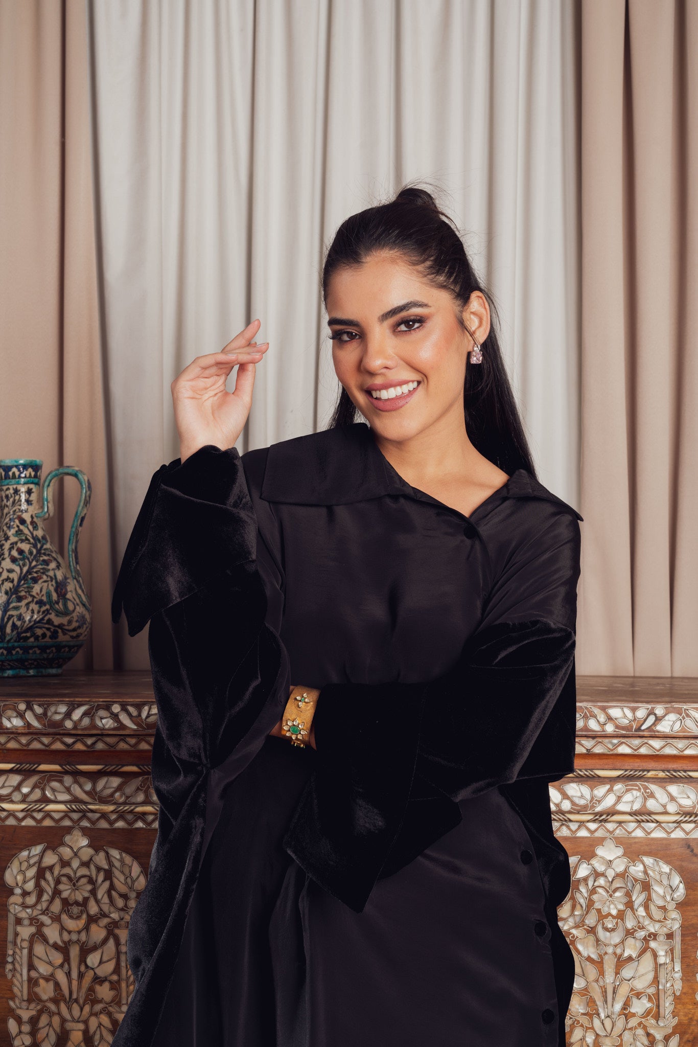A black asymmetrical dress with a loose fit