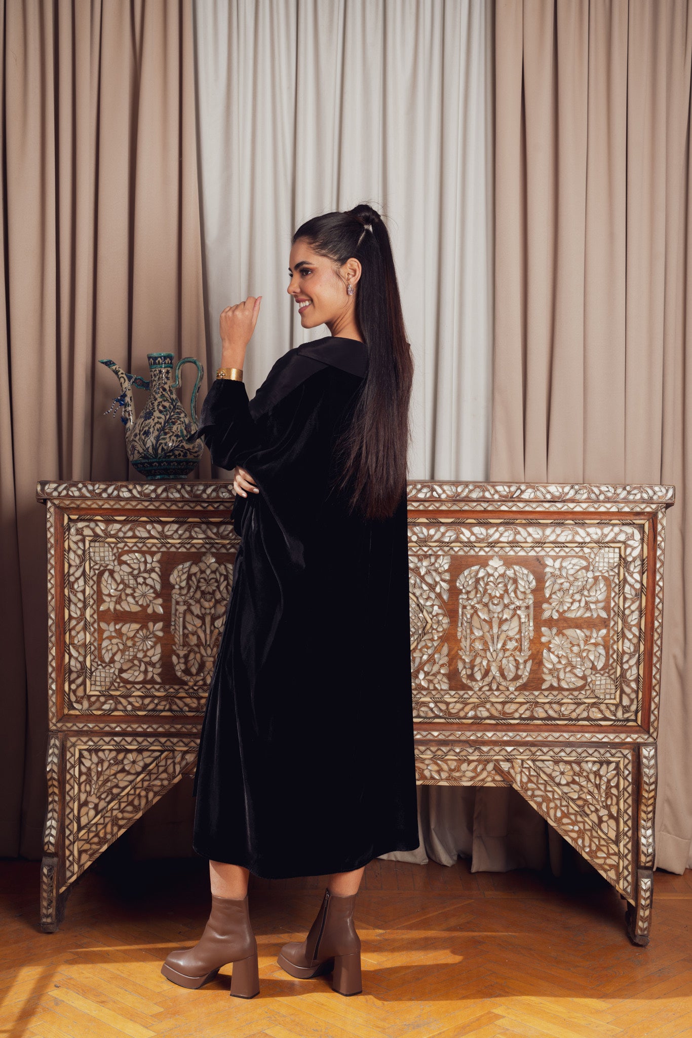 A black asymmetrical dress with a loose fit