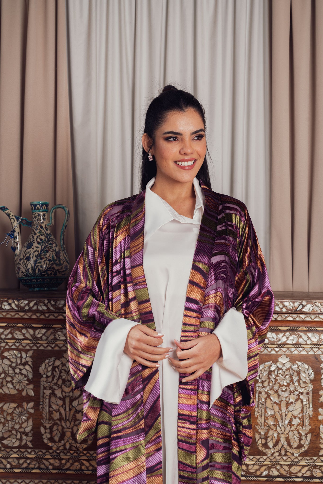 kimono with bold purple, pink, and gold patterns