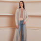 a long, flowing, light beige cardigan