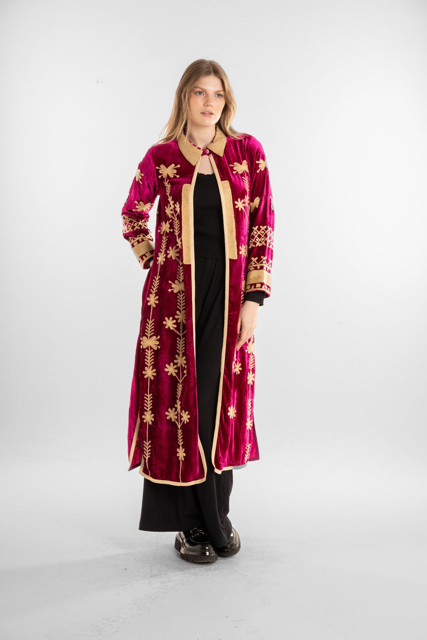 A rich fuchsia velvet kaftan adorned