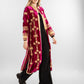 A rich fuchsia velvet kaftan adorned