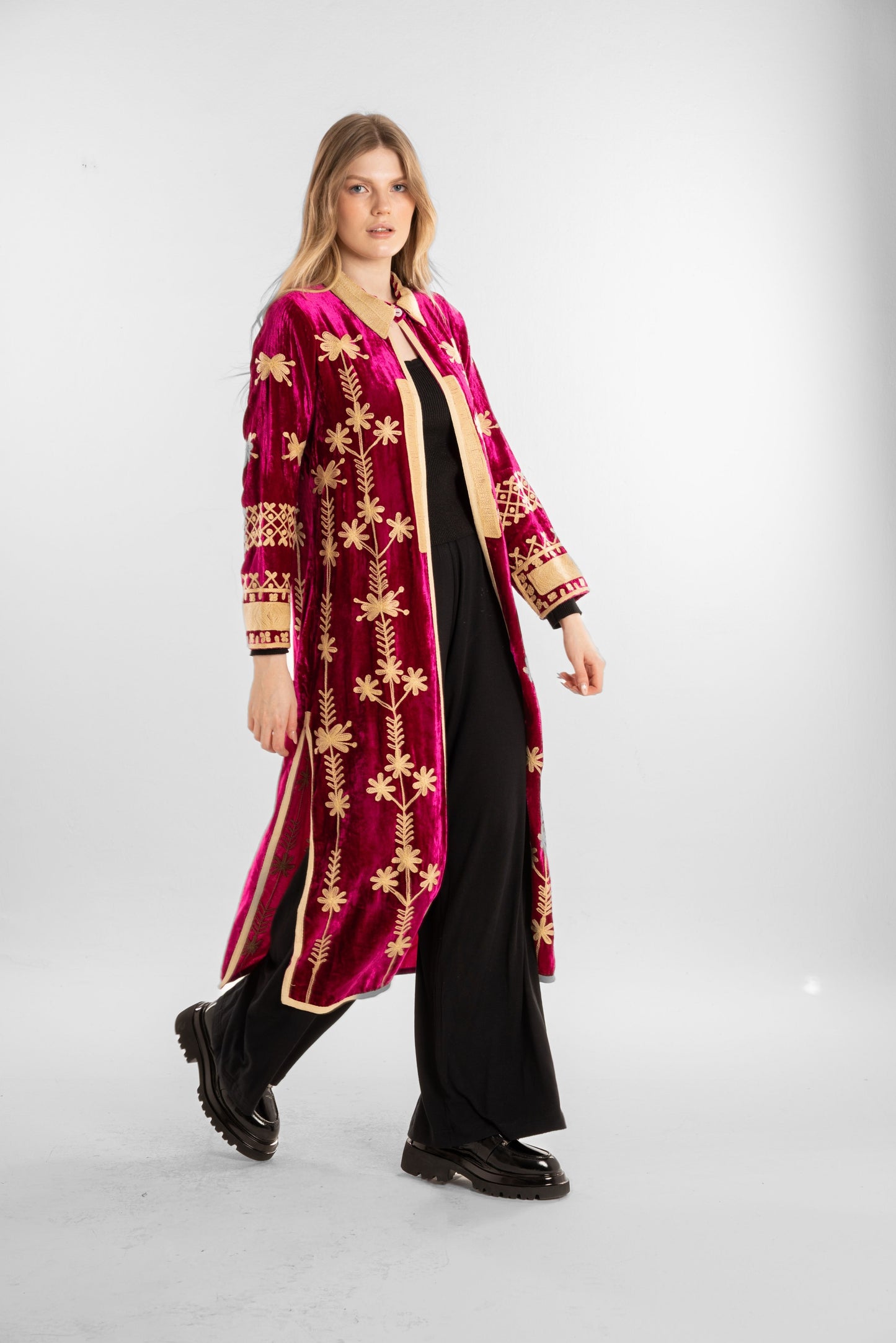 A rich fuchsia velvet kaftan adorned