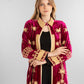 A rich fuchsia velvet kaftan adorned