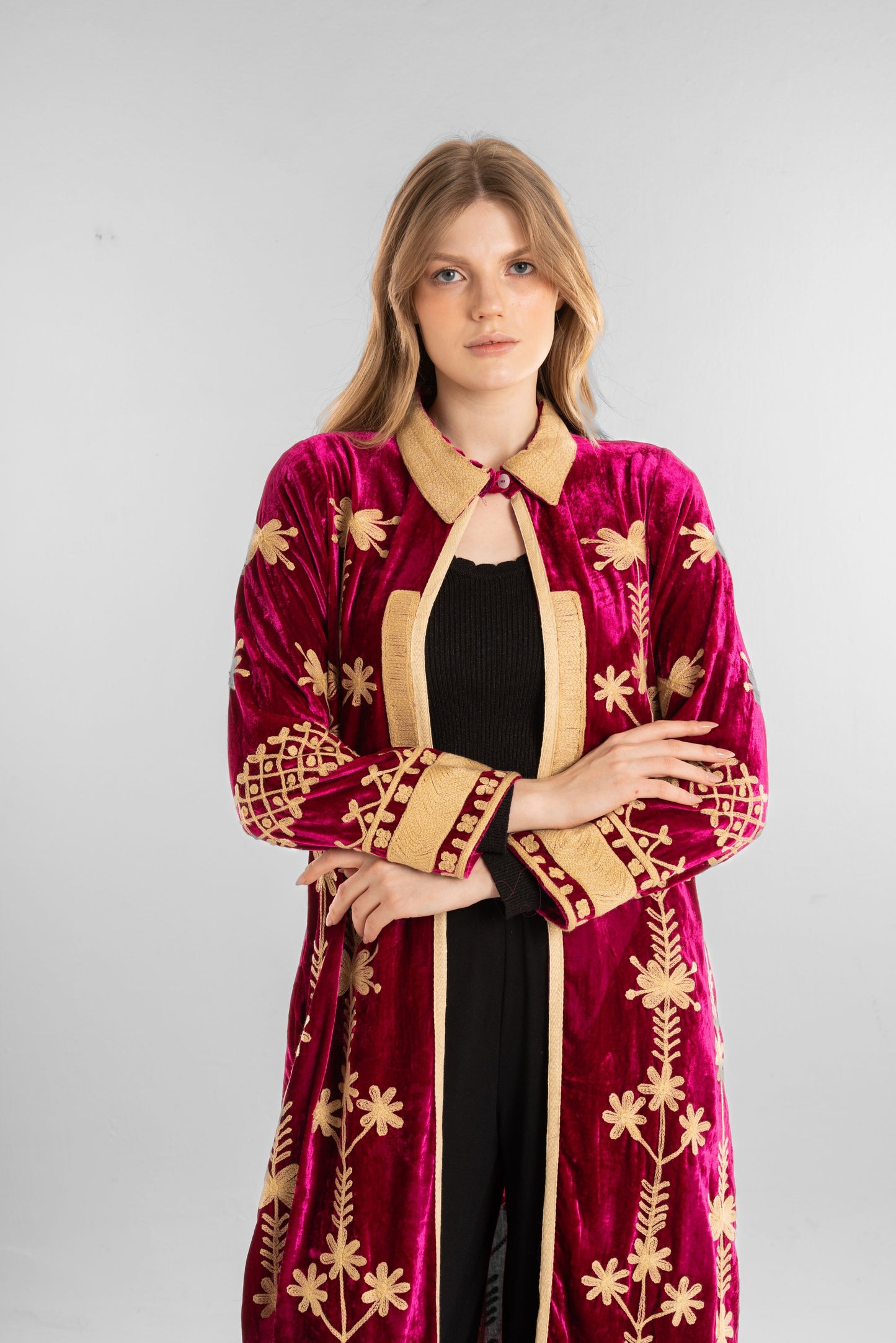 A rich fuchsia velvet kaftan adorned