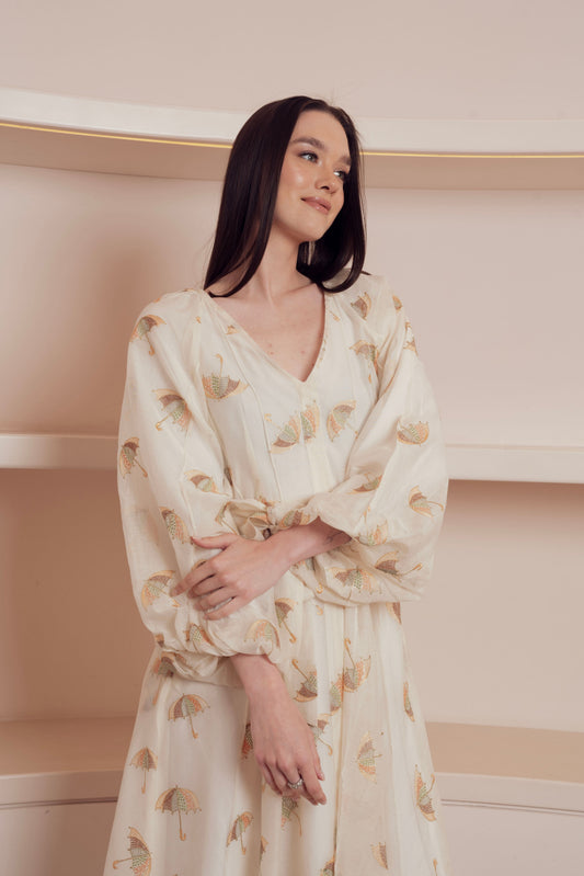 Light cream midi dress with balloon sleeves and delicate umbrella print.