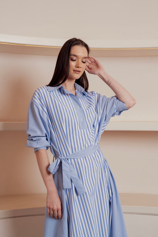 Blue and white striped shirt dress with waist tie and rolled-up sleeves.
