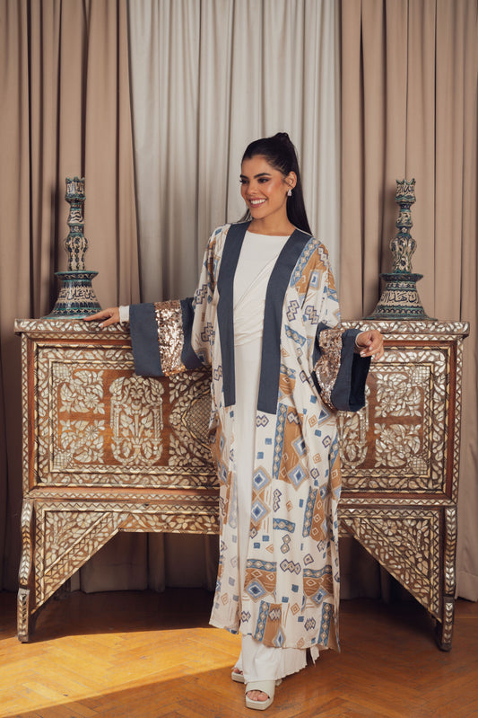 A stylish open-front kaftan featuring a geometric print in earthy tones