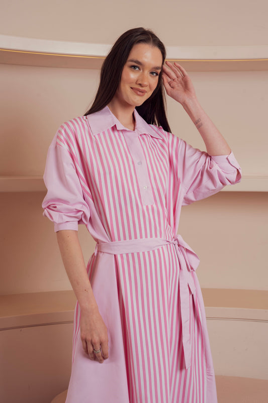 Pink and white striped shirt dress with waist tie and rolled-up sleeves.
