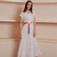 White button-down midi dress with colorful embroidered belt and collar accents.