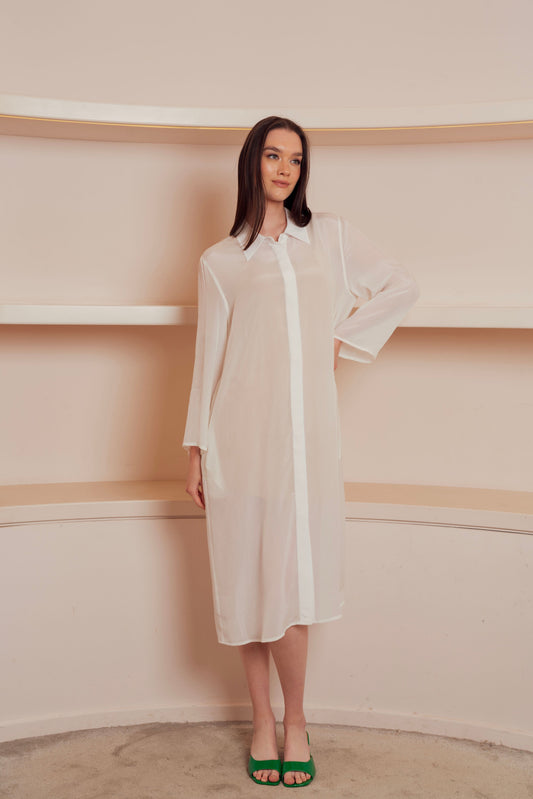 White sheer shirt dress with long sleeves and a pointed collar.