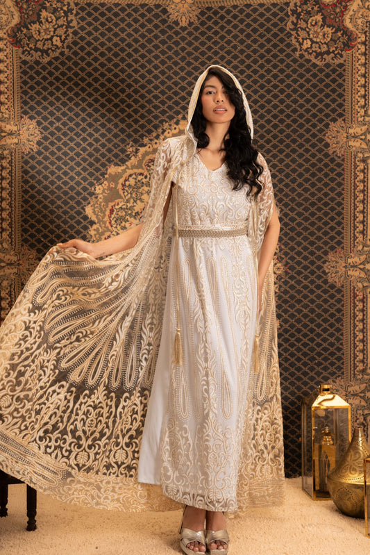 An elegant white and gold embroidered kaftan with a hood