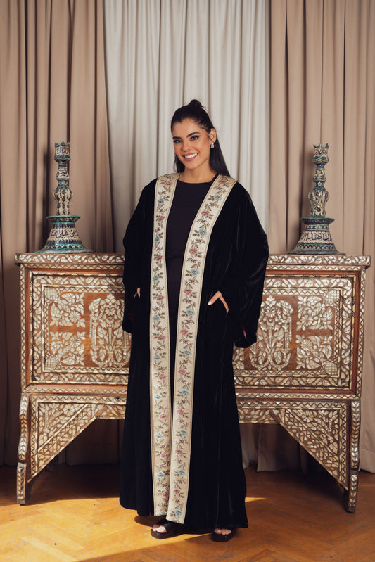 The deep black of this kimono provides the perfect backdrop for the vibrant