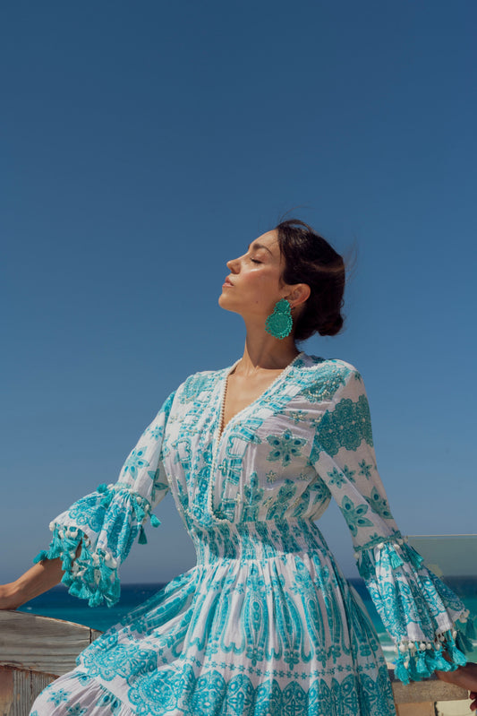 Blue dress with white print.