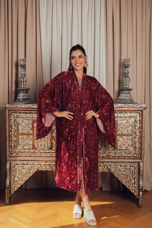 A luxurious deep red velvet kaftan