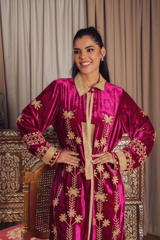 A rich fuchsia velvet kaftan adorned